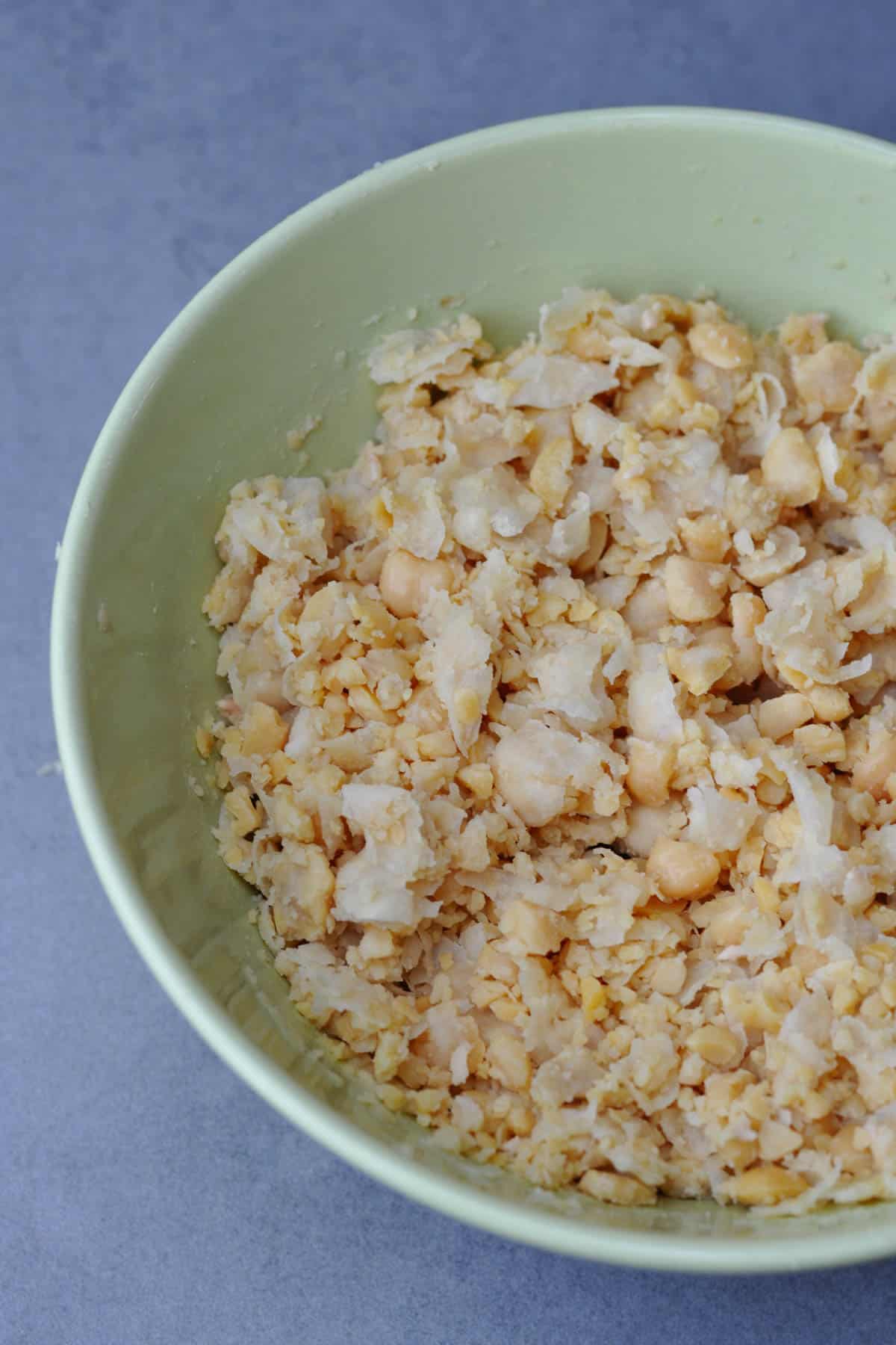 Smashed cooked chickpeas in a bowl