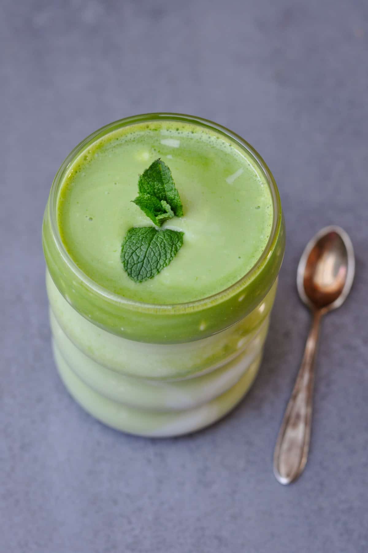 vegan green ayran (spring edition) with fresh wild garlic and mint in a glass