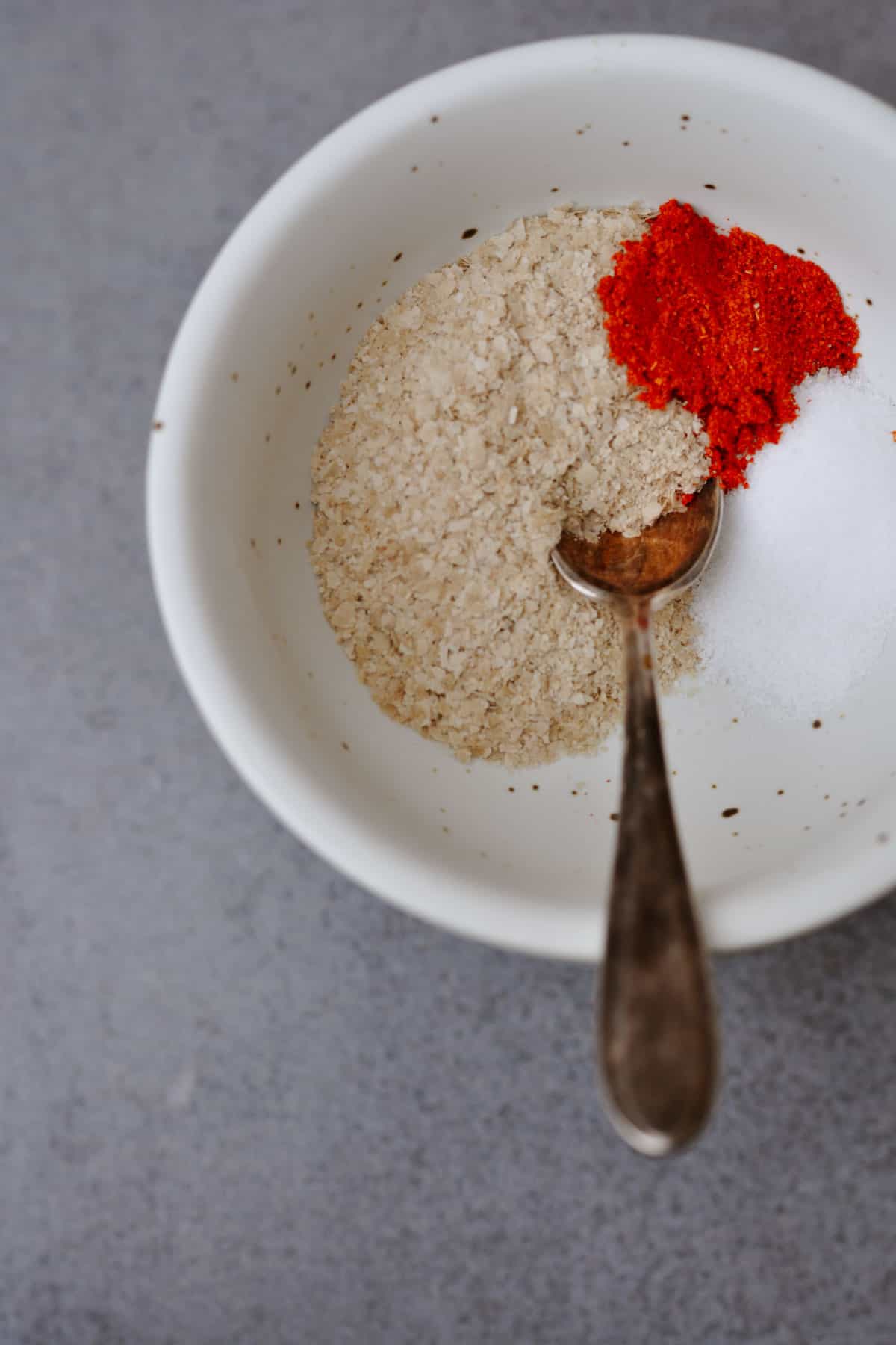 Nutritional yeast, chili powder and salt in a small bowl