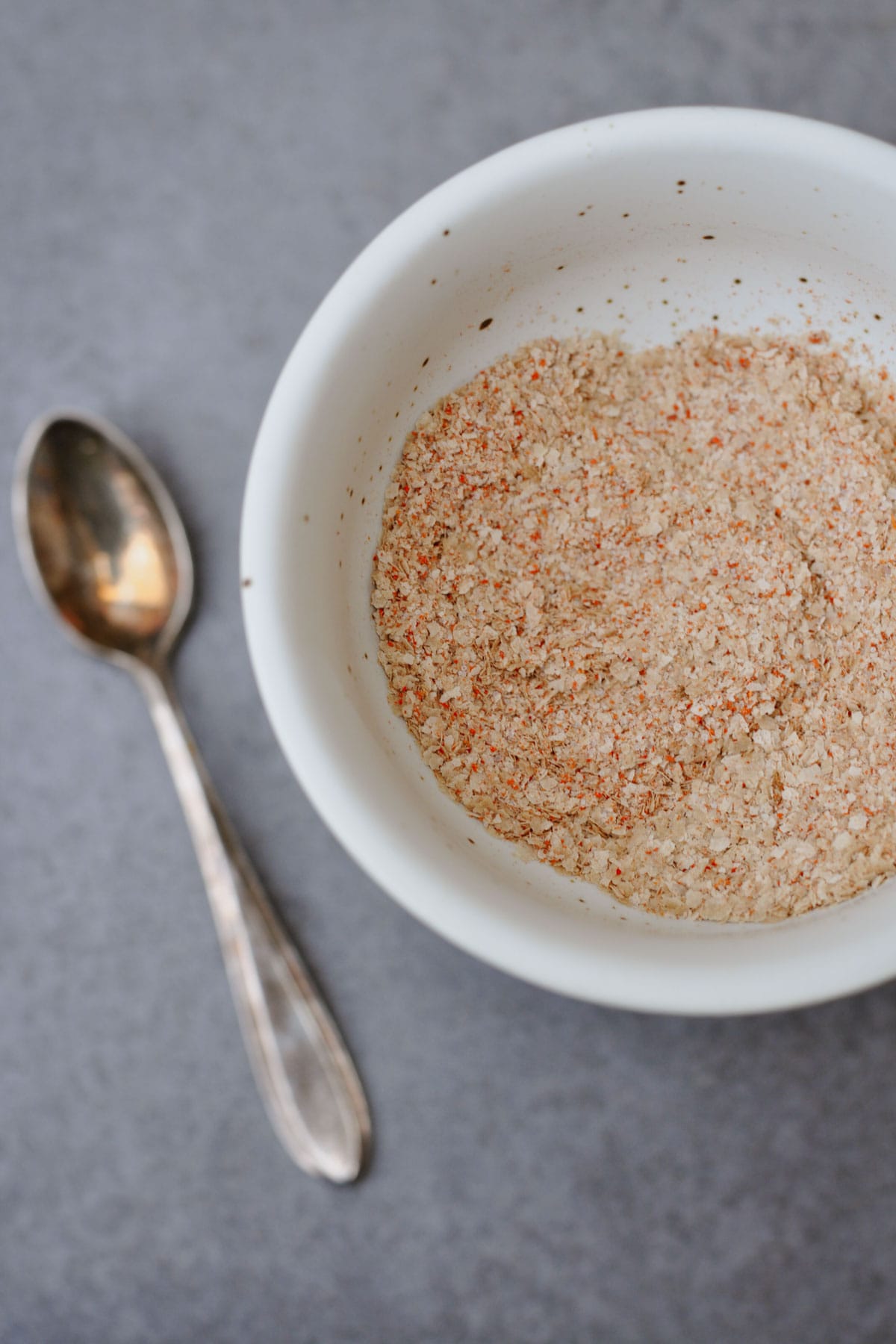 Nutritional yeast, chili powder, and salt mixed in a bowl for crunchy roasted chickpeas (oil-free) 