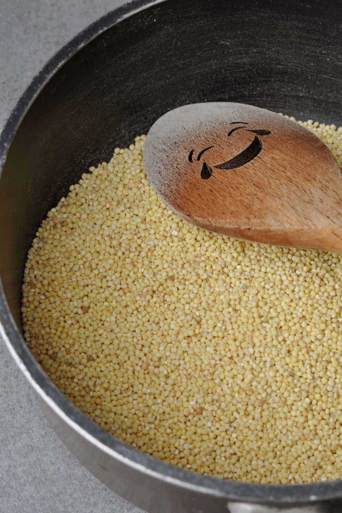 lightly toasted golden millet in pan