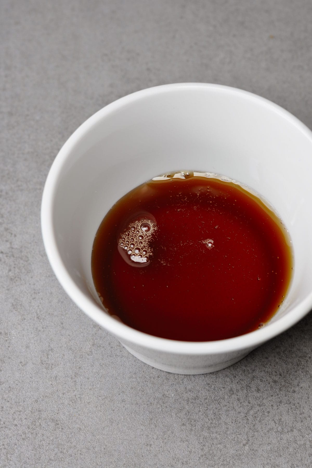 Maple syrup in a white bowl