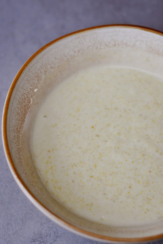 mix of Thai green curry paste with vegan yogurt in a bowl