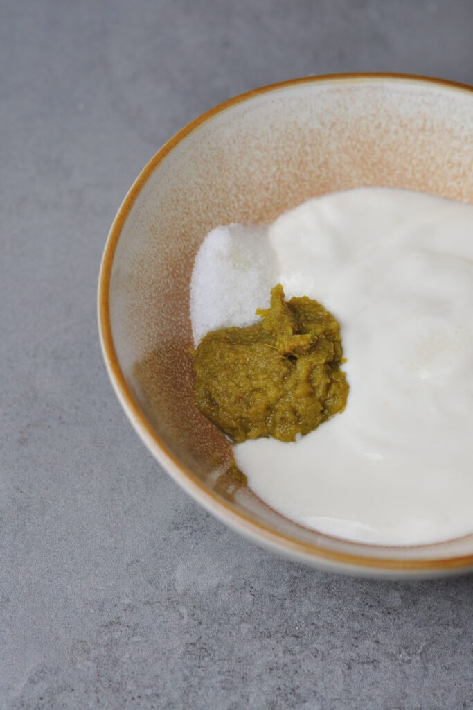 Thai green curry paste with vegan yogurt in a bowl