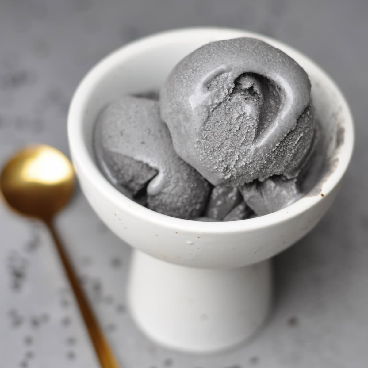 black sesame ice cream in a white bowl