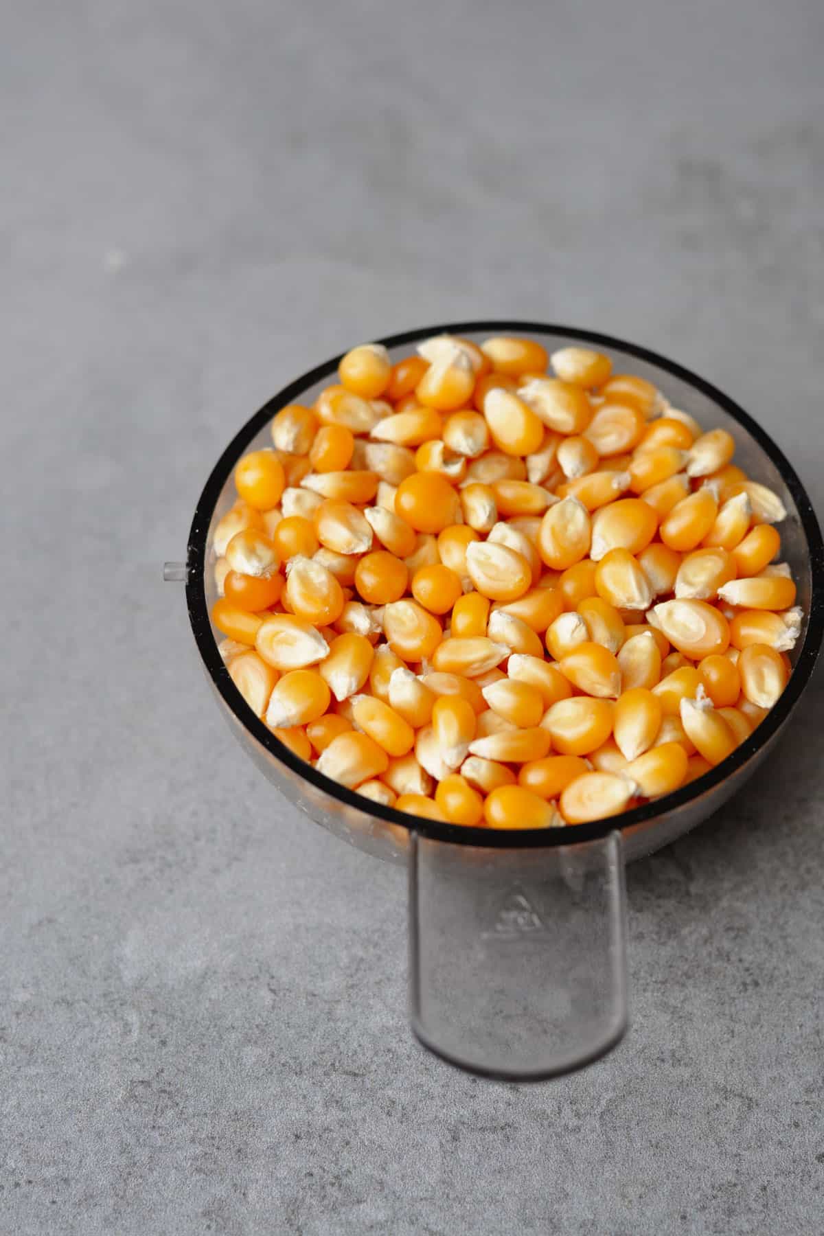 popcorn kernels in a measuring cup