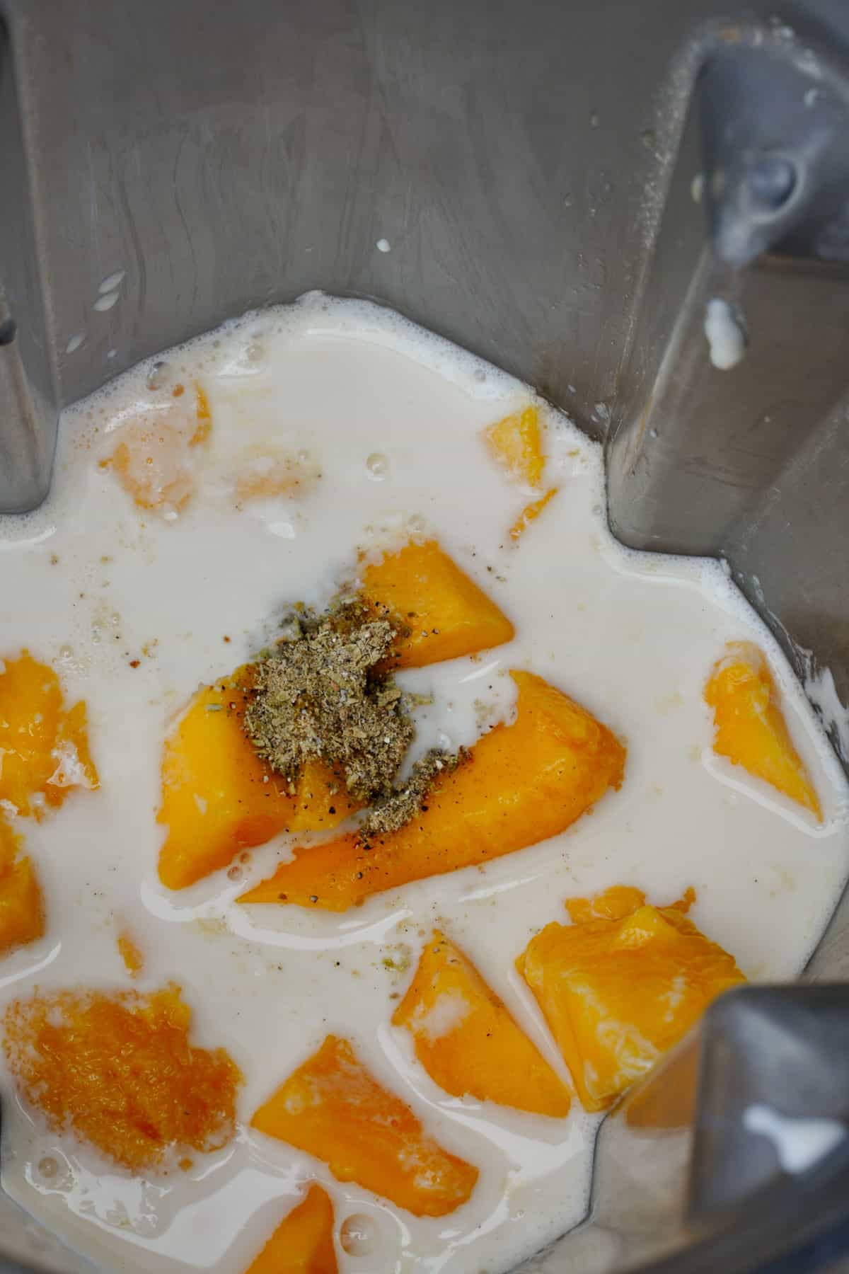 vegan mango lassi ingredients in a blender