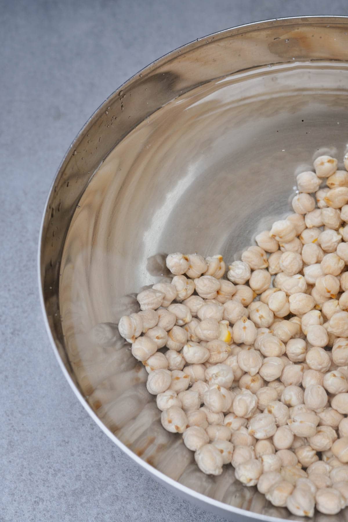 Uncooked chickpeas soaking in water