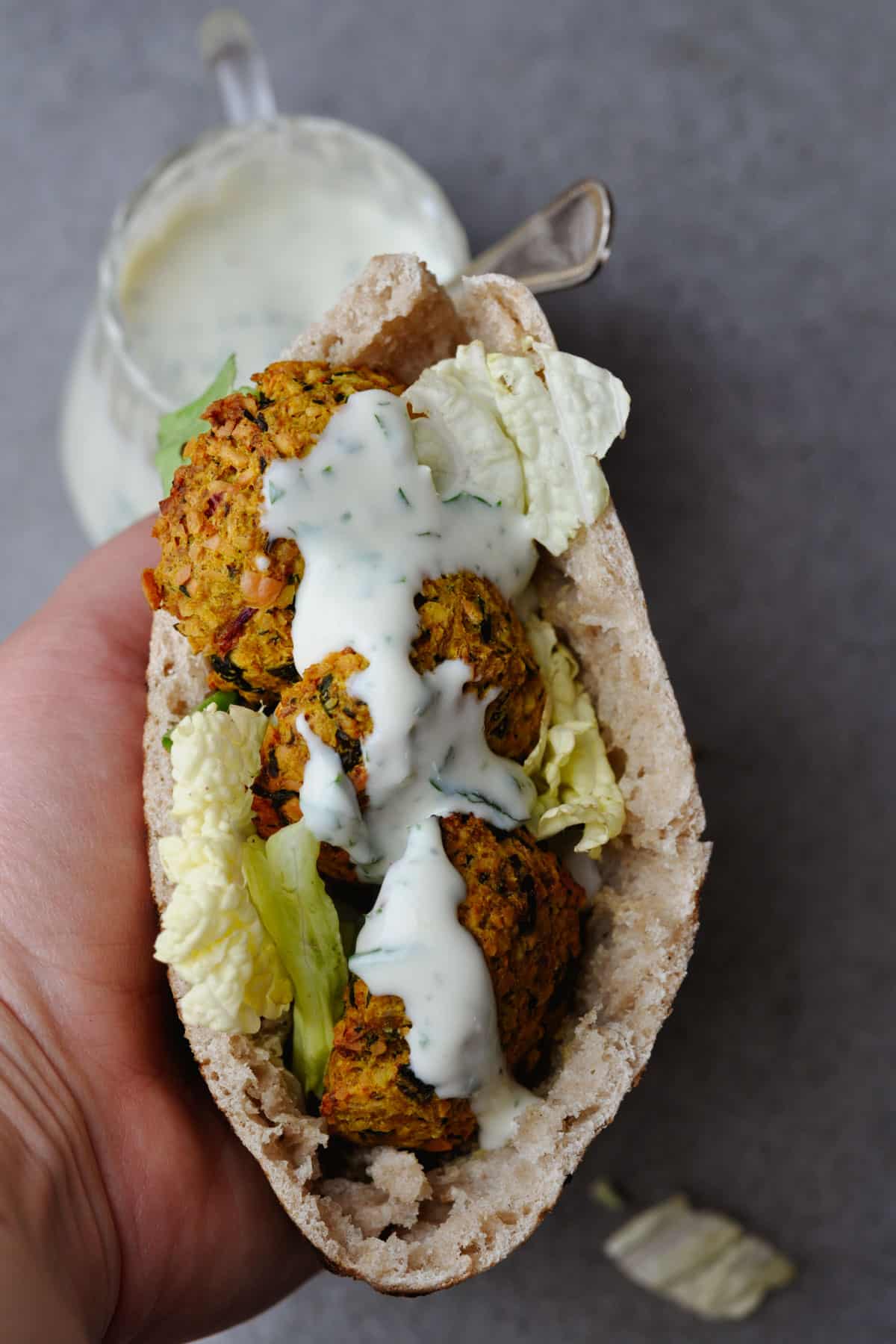 healthy falafel in pita pocket with yogurt dressing