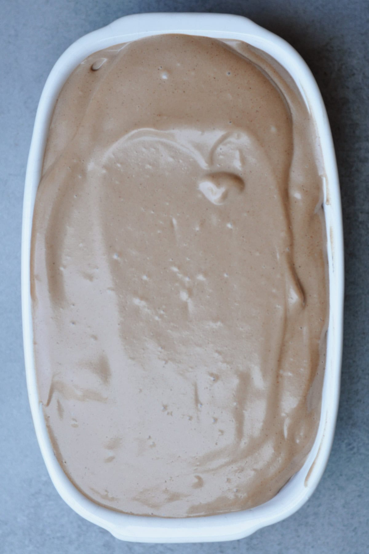 vegan nocciola chocolate gelato in a white container