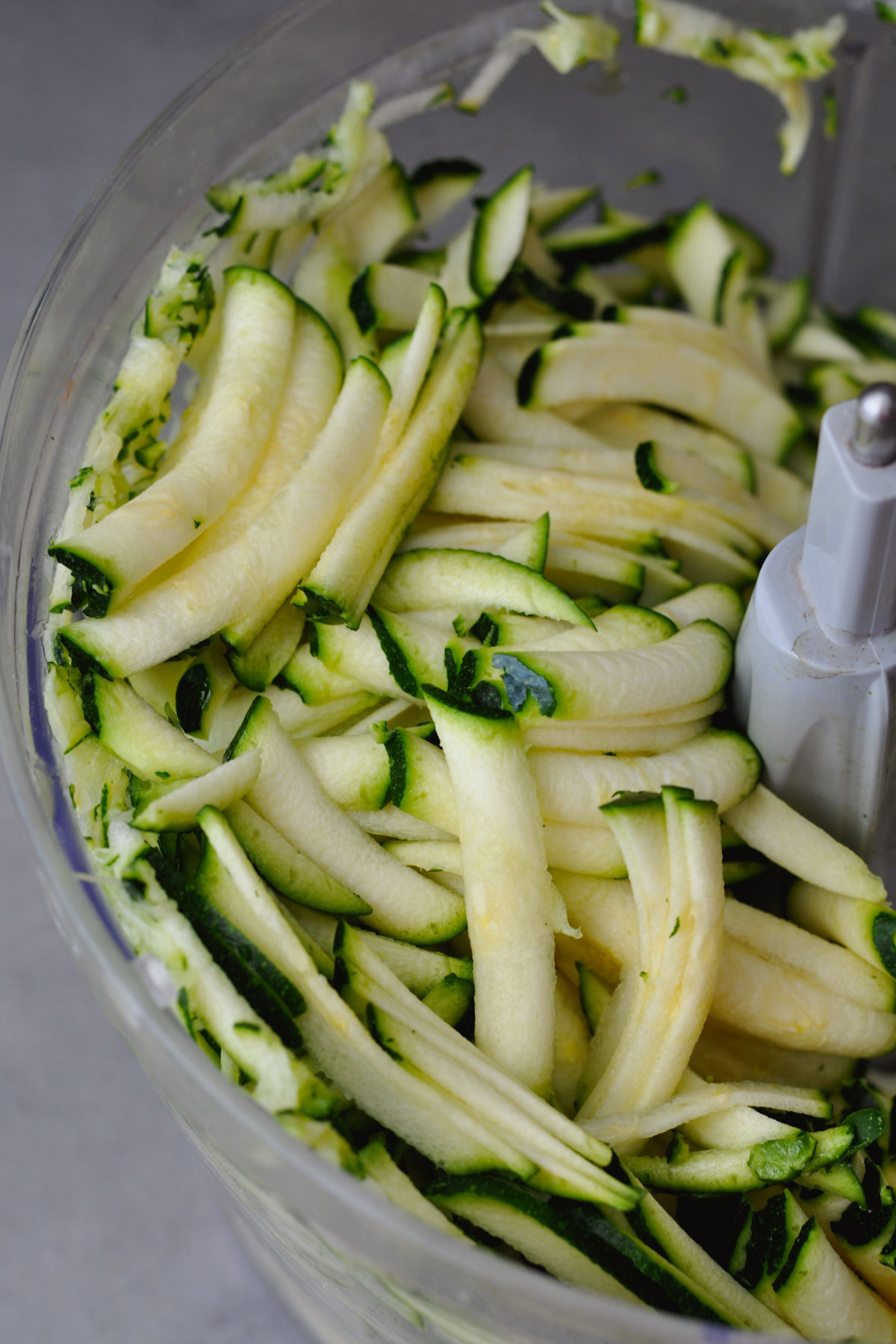 shredded zucchini in a food processor