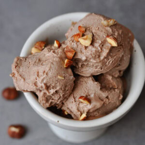 vegan nocciola and chocolate gelato in white cup