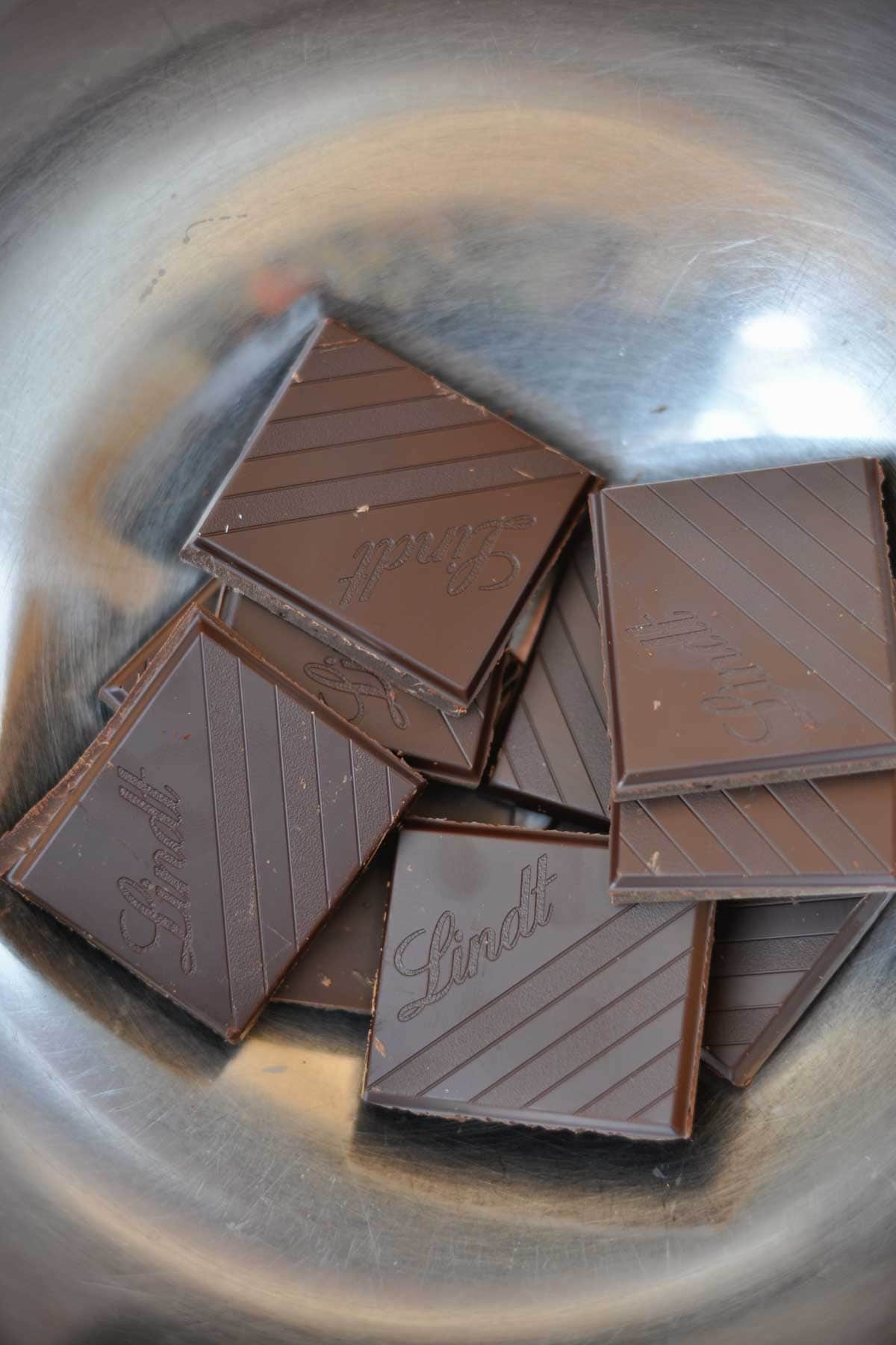 dark chocolate in a metal bowl. 