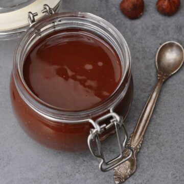 vegan gianduja chocolate spread in a small glass jar.