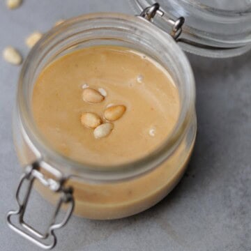 roasted pine nut butter recipe in a small glass jar.