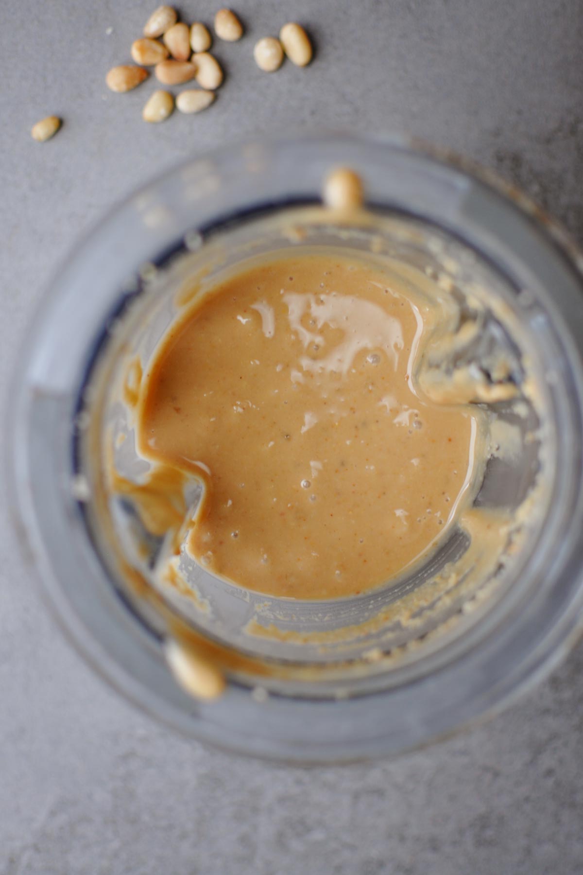 roasted pine nut butter recipe in a vitamix small blending bowl. 