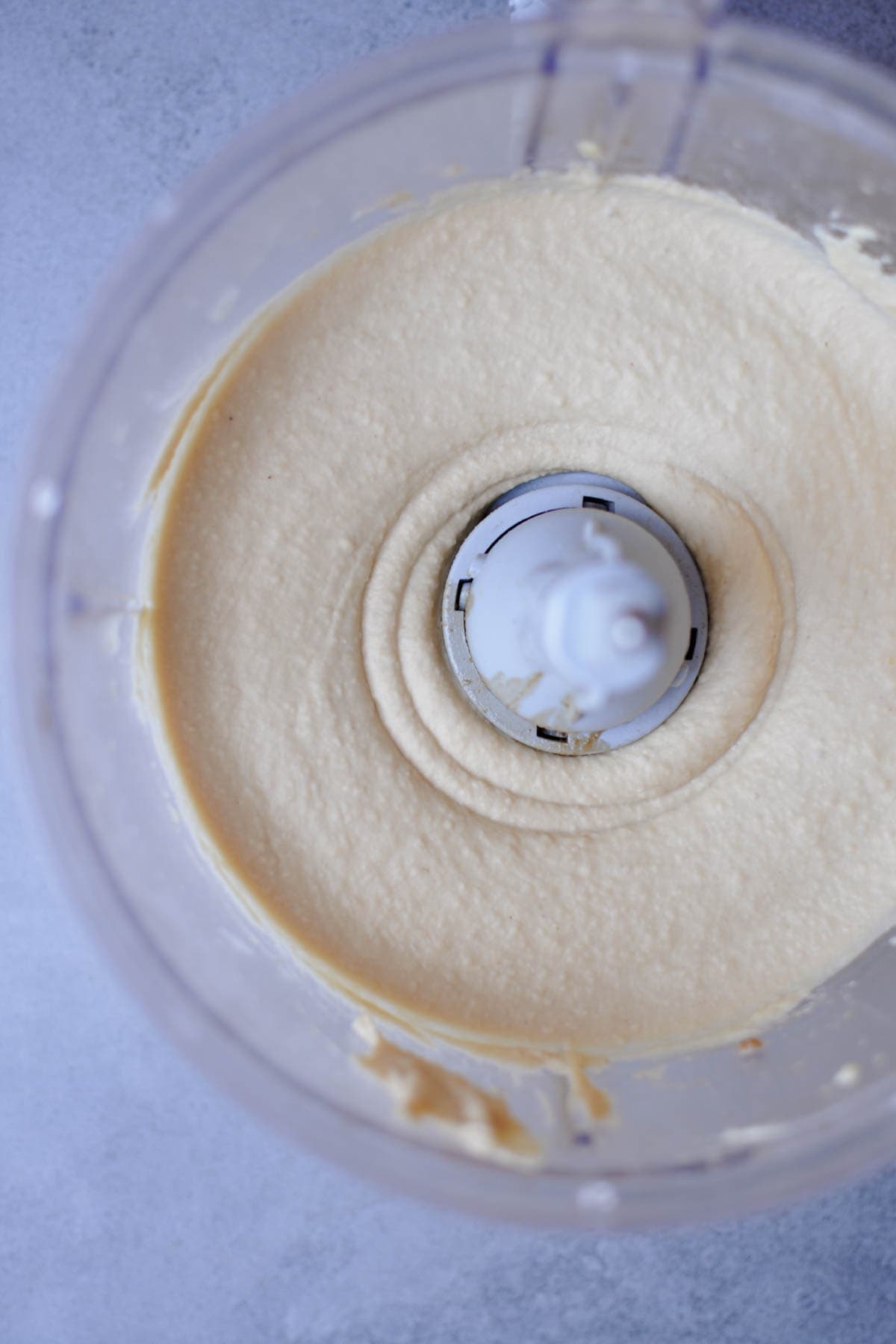 simple roasted pine nut butter hummus recipe in a food processor.