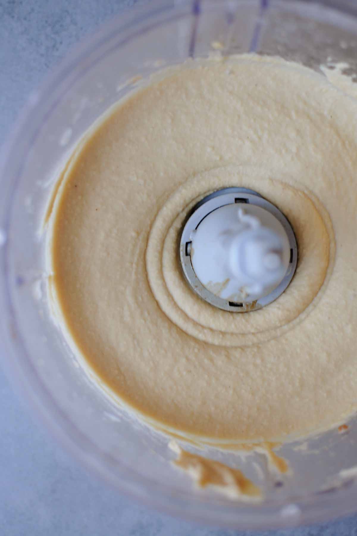 making spicy jalapeno hummus in a food processor with roasted pine nut butter instead of  tahini. 